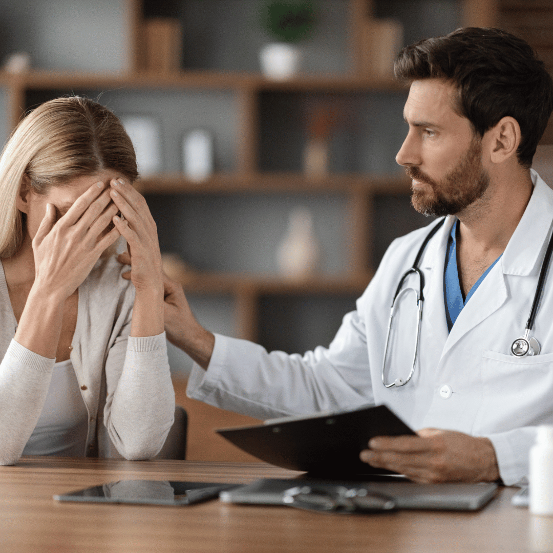 Doctor comforting patient following a bad diagnosis