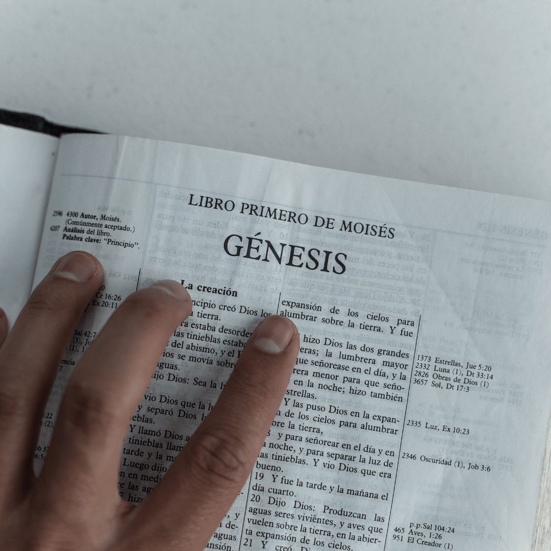 Hand turning the page of a Bible, representing renewed engagement with Scripture