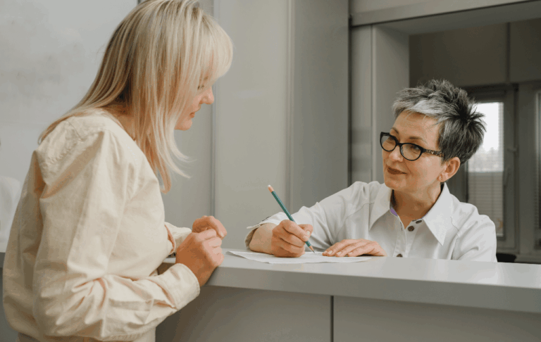 Woman talking with a receptionist