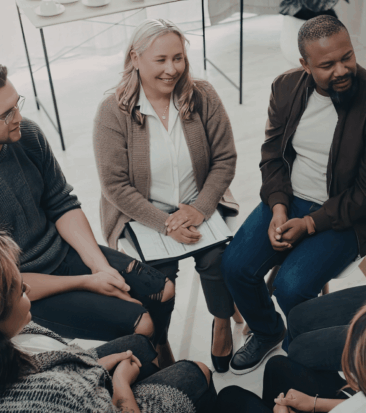 Group of people in conversation, representing who Unblur is for