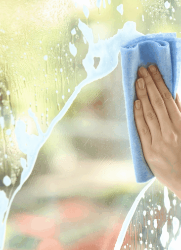 Hand wiping fog from glass, symbolizing the story behind Unblur