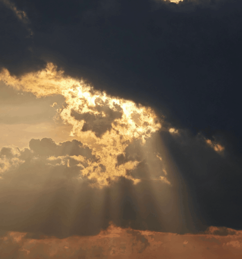 Sunbeam breaking through clouds, symbolizing God's sustaining care