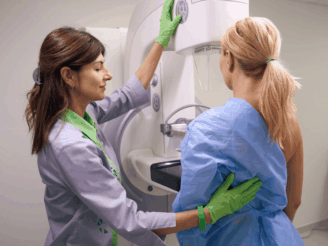 Woman about to do a mammogram
