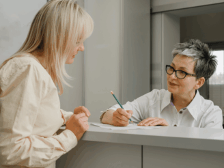 Woman talking with a receptionist